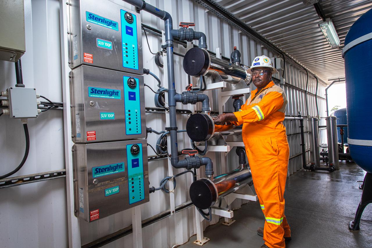 ES&S technician operating water treatment equipment